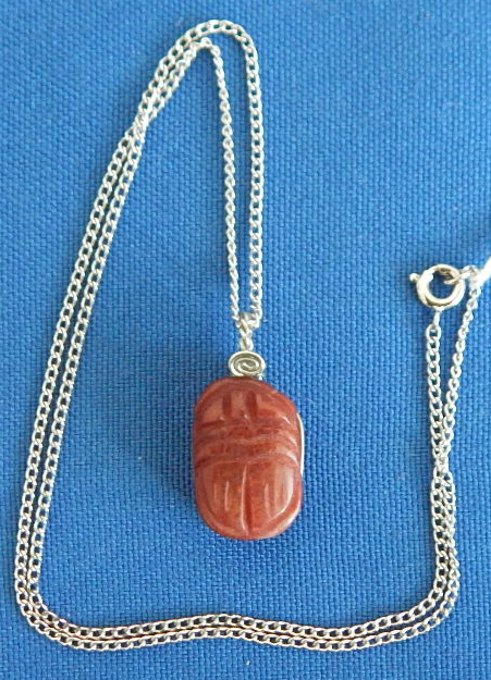 Carved Carnelian 3/4" pendant on 16" sterling silver chain