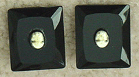 Black faceted glass clip earrings with white plastic cameos