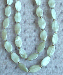 Press/molded glass bead necklace